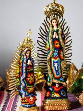 Beaded Huichol Guadalupe figurines with colorful patterns and golden crown details