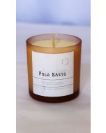 Amber glass Palo Santo hand-poured soy candle with minimalist label and natural wooden wick.
