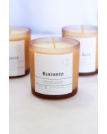 Amber glass Horchata hand-poured soy candle with minimalist label and natural wooden wick.
