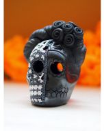 Black decorative skull with bright multicolored floral beadwork and sculpted rose headdress.
